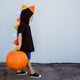 candy-corn-dinosaur-spike-hoody-modeled-with-pumpkin