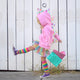 toddler-girl-playing-pink-hoodie-rainbow-skirt